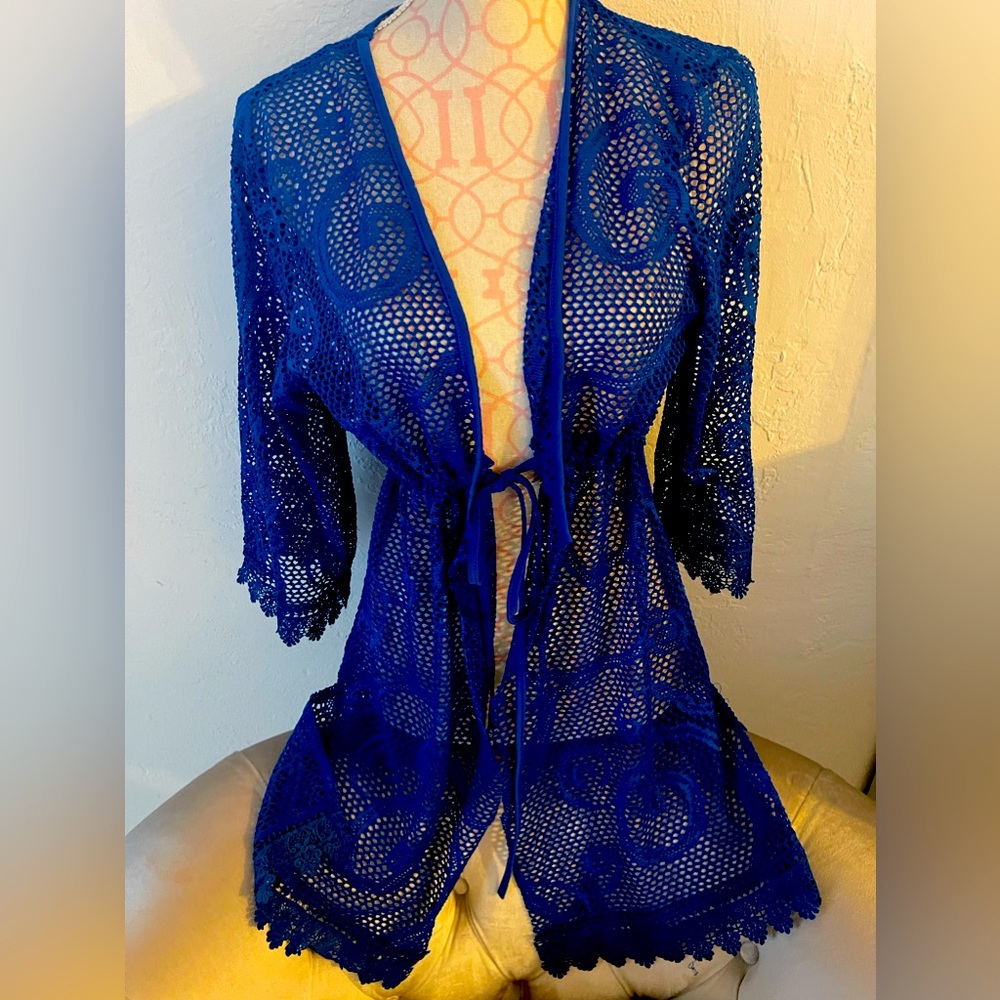 Cute and sexy, summer beach vibes coverup! Crochet lace with tie up front.